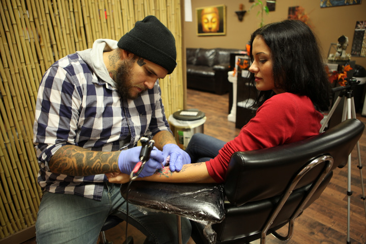 getting travel tattoo at live loud studios cincinnati ohio 