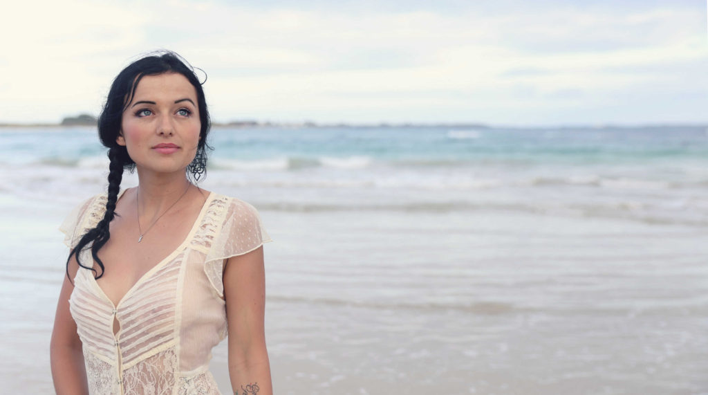 girl facing camera on beach