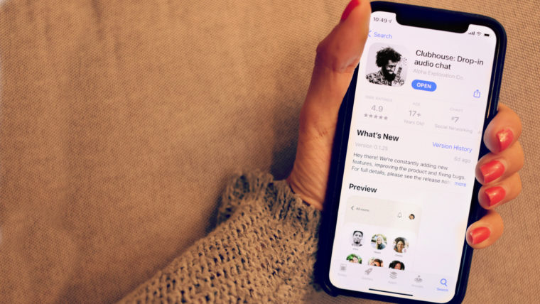 Hand Holding the Clubhouse App